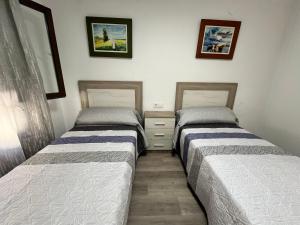 Postel nebo postele na pokoji v ubytování Apartamentos Calypso Altamar