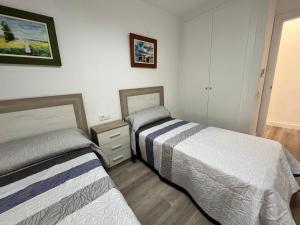 Postel nebo postele na pokoji v ubytování Apartamentos Calypso Altamar