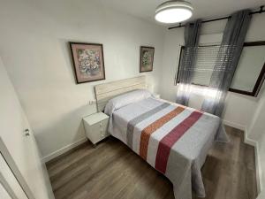 Postel nebo postele na pokoji v ubytování Apartamentos Calypso Altamar