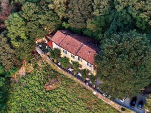 an aerial view of a house with cars parked in front at Ristorante Hotel Falchetto in Brunate