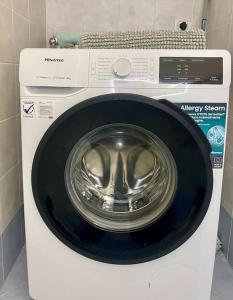 a washing machine with a bowl on top of it at Appartamento Giardino e Parcheggio in Borgio Verezzi