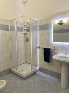 a bathroom with a shower and a sink at Appartamento Giardino e Parcheggio in Borgio Verezzi +18 photos