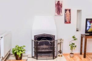 a living room with a fire place in the wall at Opera House 2BR Apt with Tbilisi Charm - By Wehost in Tbilisi City