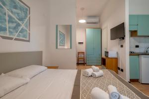 A bed or beds in a room at Residence Le Vele