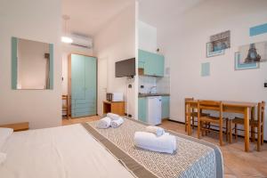 A bed or beds in a room at Residence Le Vele