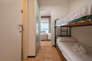 A bed or beds in a room at Residence Le Vele