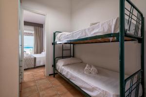A bed or beds in a room at Residence Le Vele
