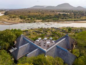an aerial view of a house in the middle of a river at Pestana Kruger Lodge in Malelane