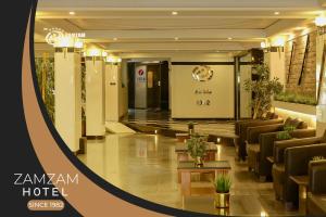 a lobby of a hotel with couches and chairs at Zamzam Hotel 1 in An Najaf