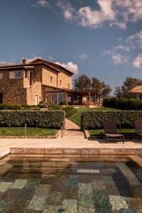 The swimming pool at or close to Mastrojanni Relais