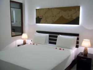 Postel nebo postele na pokoji v ubytování Sunrise Palace Negombo