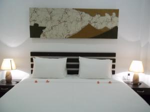 Postel nebo postele na pokoji v ubytování Sunrise Palace Negombo