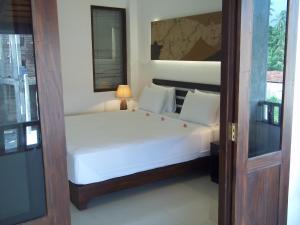 Postel nebo postele na pokoji v ubytování Sunrise Palace Negombo