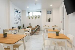 Posezení v ubytování Madalena Hostel e Suites