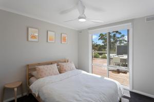 Ένα ή περισσότερα κρεβάτια σε δωμάτιο στο Imollu Beach House 5-Bed 2 5-Bath