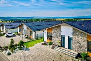 an image of a house with solar panels on the roof at TATRYSTAY Cactus Premium Villa High Tatras private Wellness in Stará Lesná