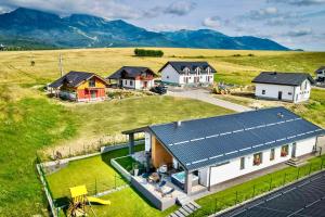 an overhead view of a house with a solar roof at TATRYSTAY Cactus Premium Villa High Tatras private Wellness in Stará Lesná