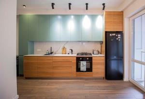 Nhà bếp/bếp nhỏ tại 2BR Colorful Apt on Vera Near Stamba - By Wehost
