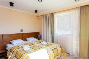 Ένα ή περισσότερα κρεβάτια σε δωμάτιο στο Cozy and Comfortable Apartment in Gudauri