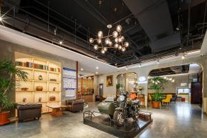 Posezení v ubytování Cosy Feeling Hotel - Beijing Headquarters Xinfadi