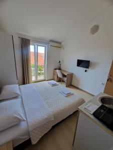 Postel nebo postele na pokoji v ubytování Guest House Damjana