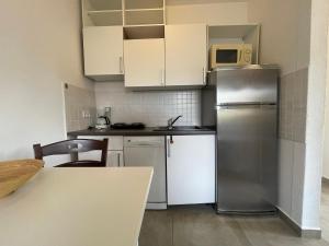 Kuchyň nebo kuchyňský kout v ubytování Apartments G&G