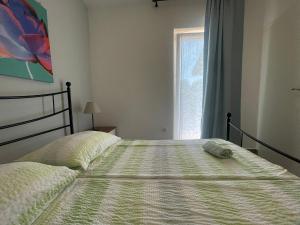 Postel nebo postele na pokoji v ubytování Apartments G&G