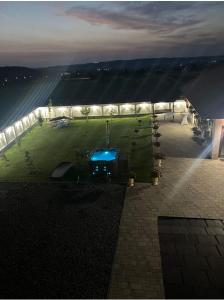 an overhead view of a garden with lights on a building at Casă de Vacanță Raul in Gura Rîului