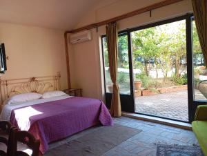 Postel nebo postele na pokoji v ubytování MARIA HOLIDAY HOMES La Pineta di Sinalunga