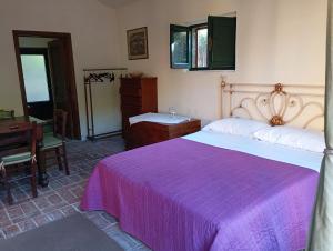 Postel nebo postele na pokoji v ubytování MARIA HOLIDAY HOMES La Pineta di Sinalunga