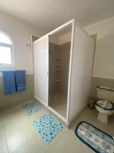 a bathroom with a shower and a toilet at Beautiful house in secure subdivision in Acapulco +12 photos
