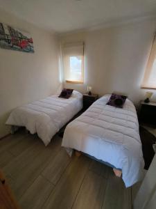 Postel nebo postele na pokoji v ubytování APART HOTEL EN BULNES
