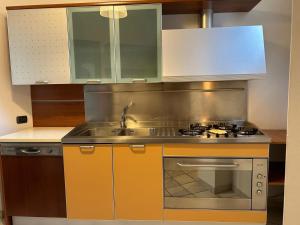 a kitchen with a sink and a stove at casa di Gigia in Serra San Bruno