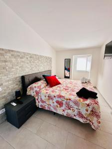 a bedroom with a bed with a red pillow at La casa di Stella in Isernia