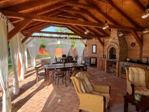 a large open patio with a table and chairs at Annushka Apartman in Sarud