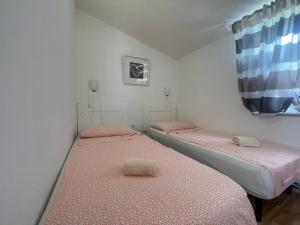 Postel nebo postele na pokoji v ubytování Apartments G&G
