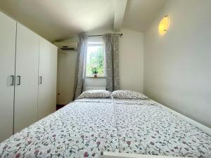 Postel nebo postele na pokoji v ubytování Apartments G&G