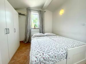 Postel nebo postele na pokoji v ubytování Apartments G&G