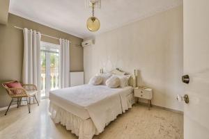 Ένα ή περισσότερα κρεβάτια σε δωμάτιο στο Villa Apolafste +33 φωτογραφίες