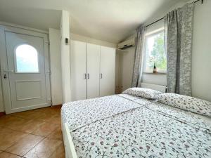 Postel nebo postele na pokoji v ubytování Apartments G&G