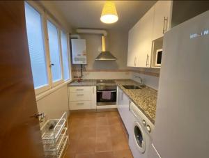 a kitchen with a sink and a dishwasher at Sego Apartments I in Segovia
