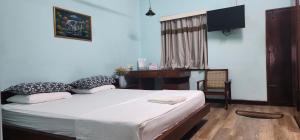 Postel nebo postele na pokoji v ubytování CHARAKAMA Guest Bungalow - GAMPAHA
