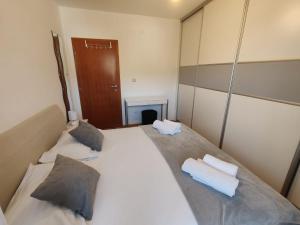Postel nebo postele na pokoji v ubytování Apartment EMMI