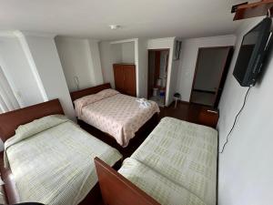 Hotel Santris客房内的一张或多张床位