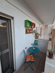 a small patio with a table and two chairs at CasaLina Apartment in Manduria +29 photos