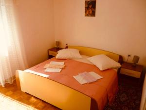 Postel nebo postele na pokoji v ubytování Apartmani Babaja