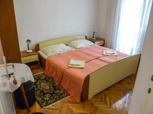 Postel nebo postele na pokoji v ubytování Apartmani Babaja + 22 fotografií