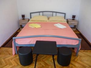Postel nebo postele na pokoji v ubytování Apartmani Babaja