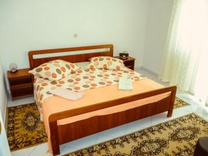 Postel nebo postele na pokoji v ubytování Apartmani Babaja
