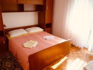 Postel nebo postele na pokoji v ubytování Apartmani Babaja
